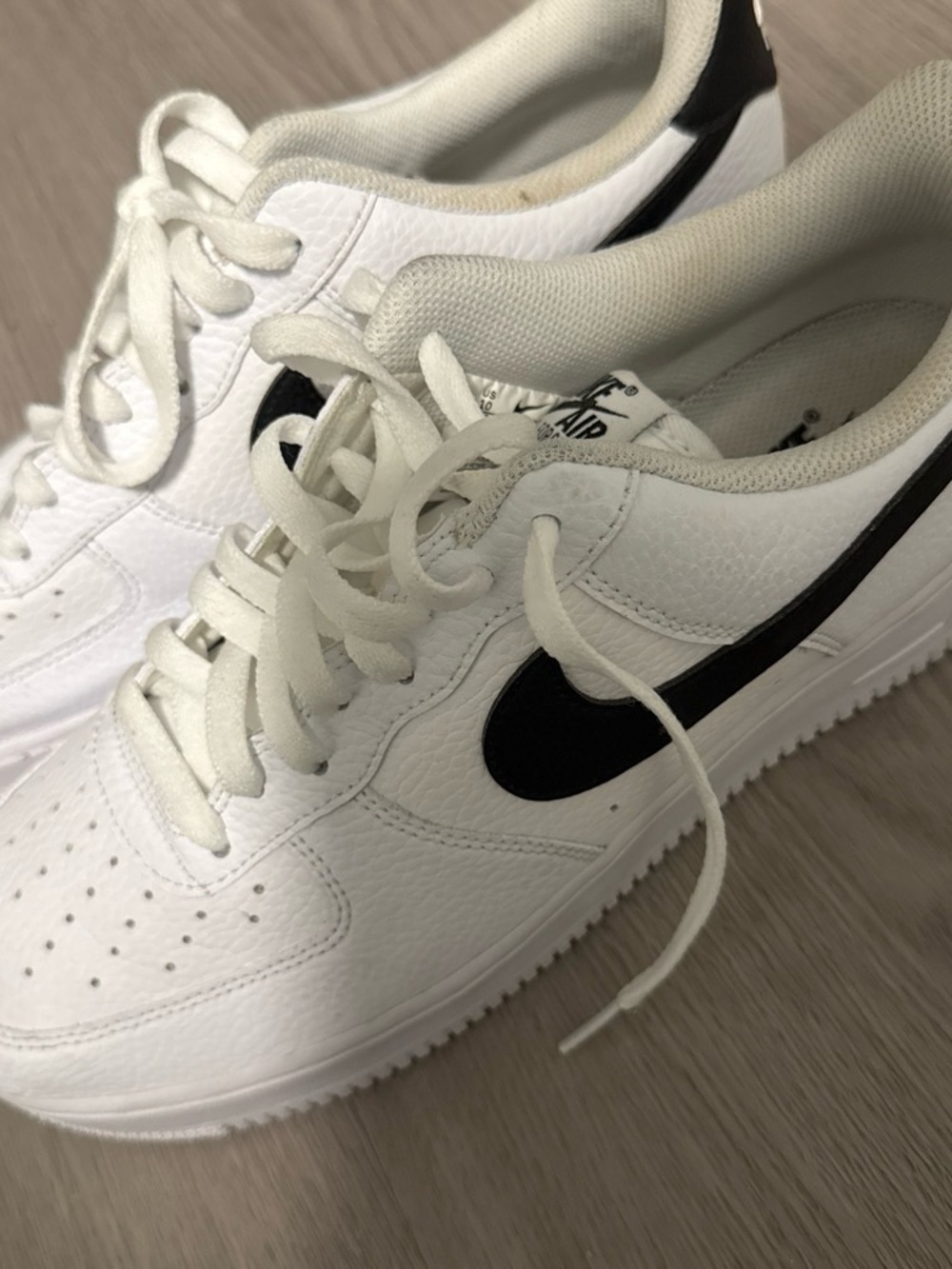 Nike Kids White Sneakers with Black Swoosh